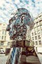 Moving statue of Franz Kafka in Prague, yellow filter Royalty Free Stock Photo